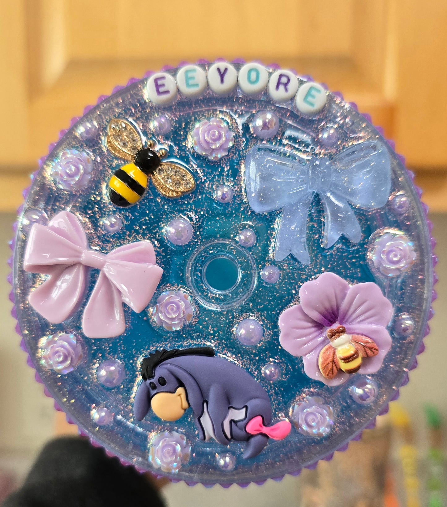 Eeyore bling drip cup with decorated lid.