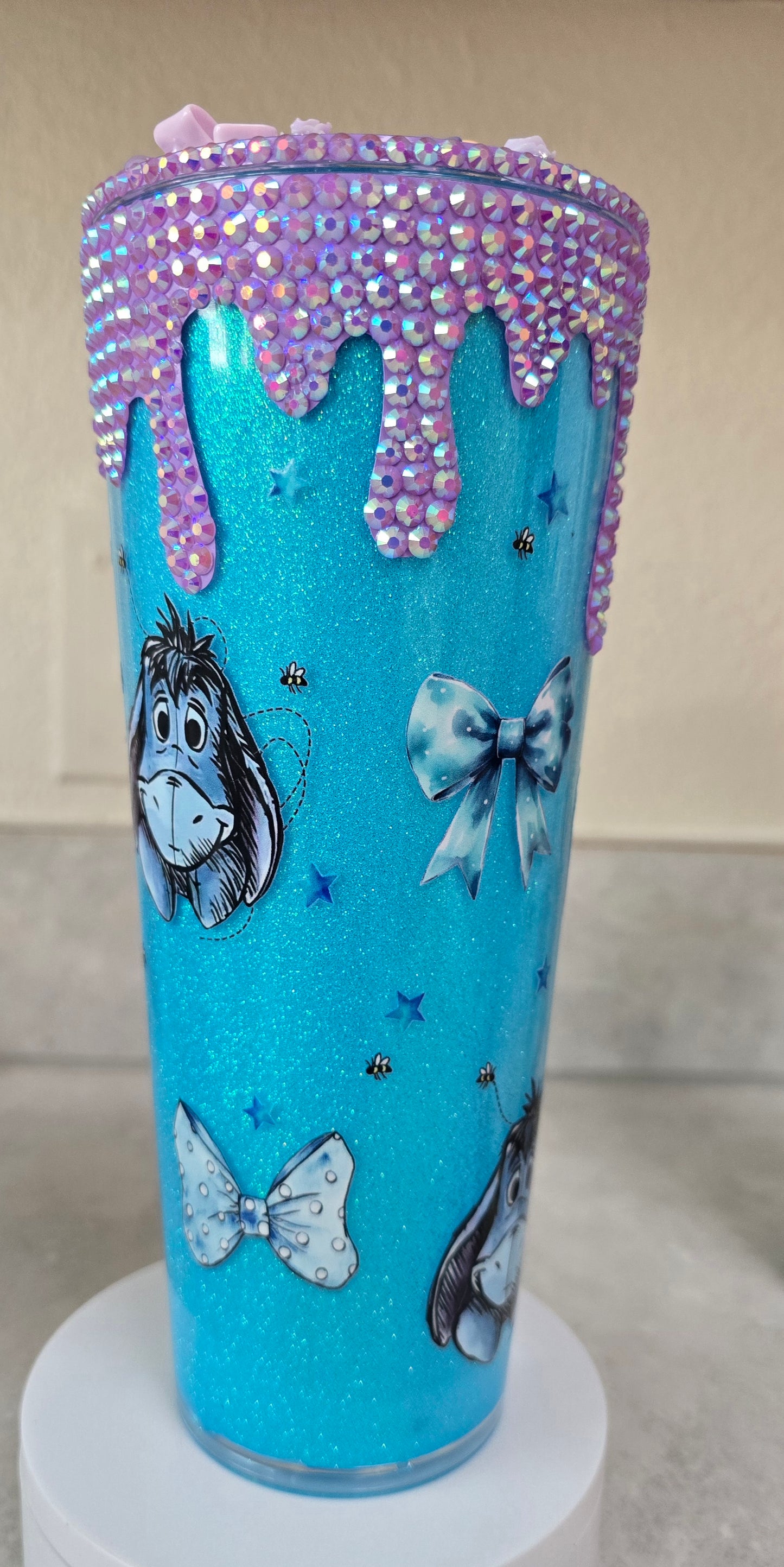 Eeyore bling drip cup with decorated lid.